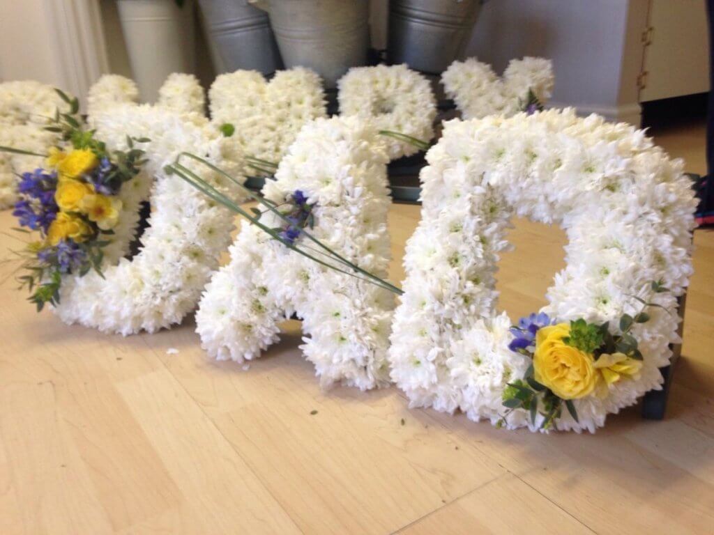 Chrysanthemums spelling dad for a memorial
