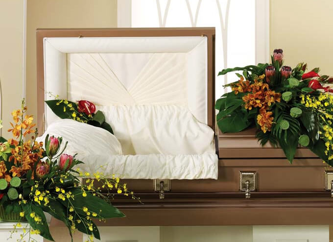 Funeral Flower Spray on Open Half-Couch Casket