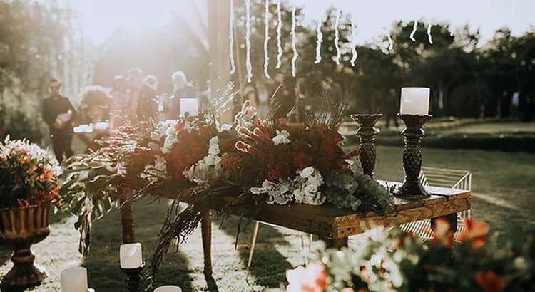 outdoor typical american funeral wake with flower spray and guests