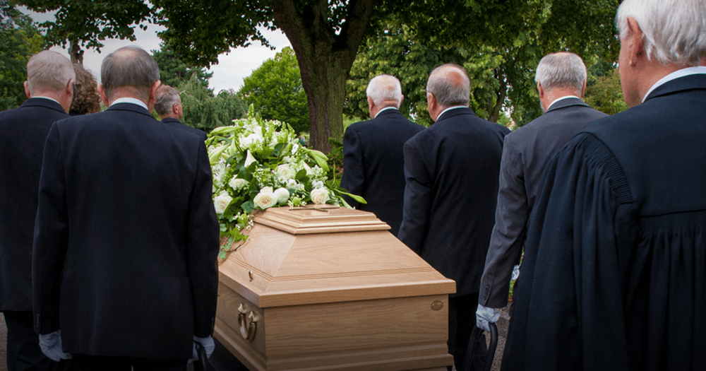 pallbearers carrying casket