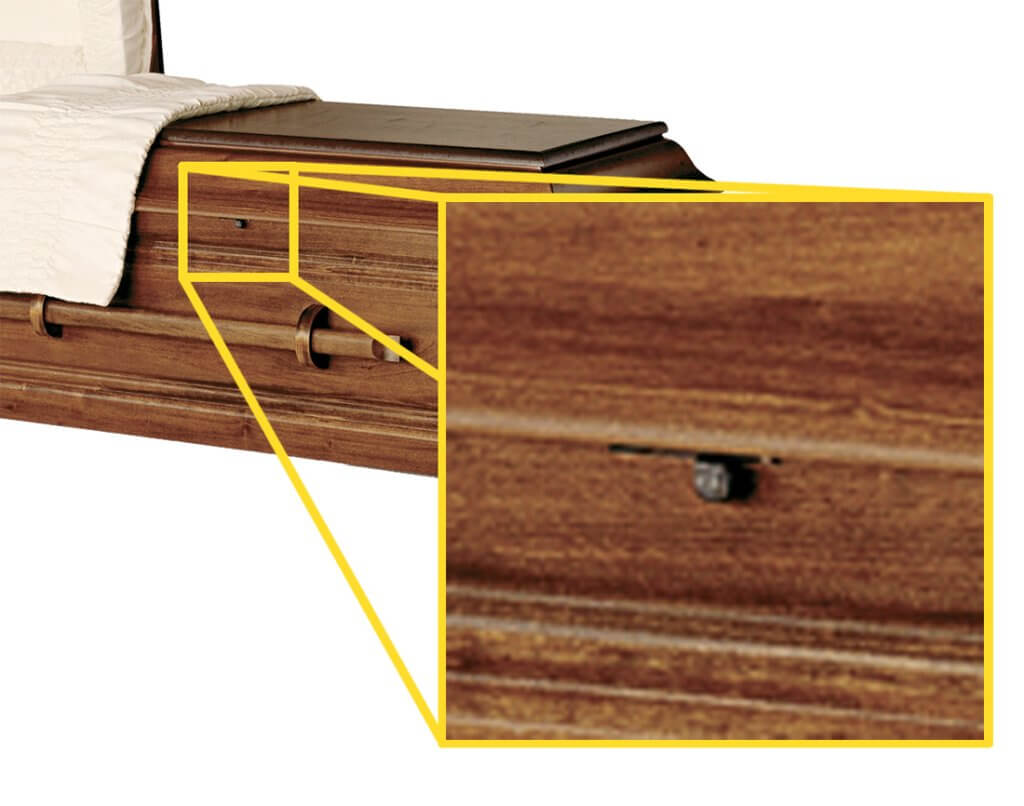 Close up of casket locking metal clasp on wooden casket