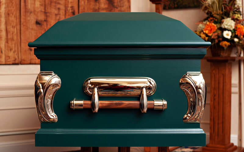 end of a green colored casket