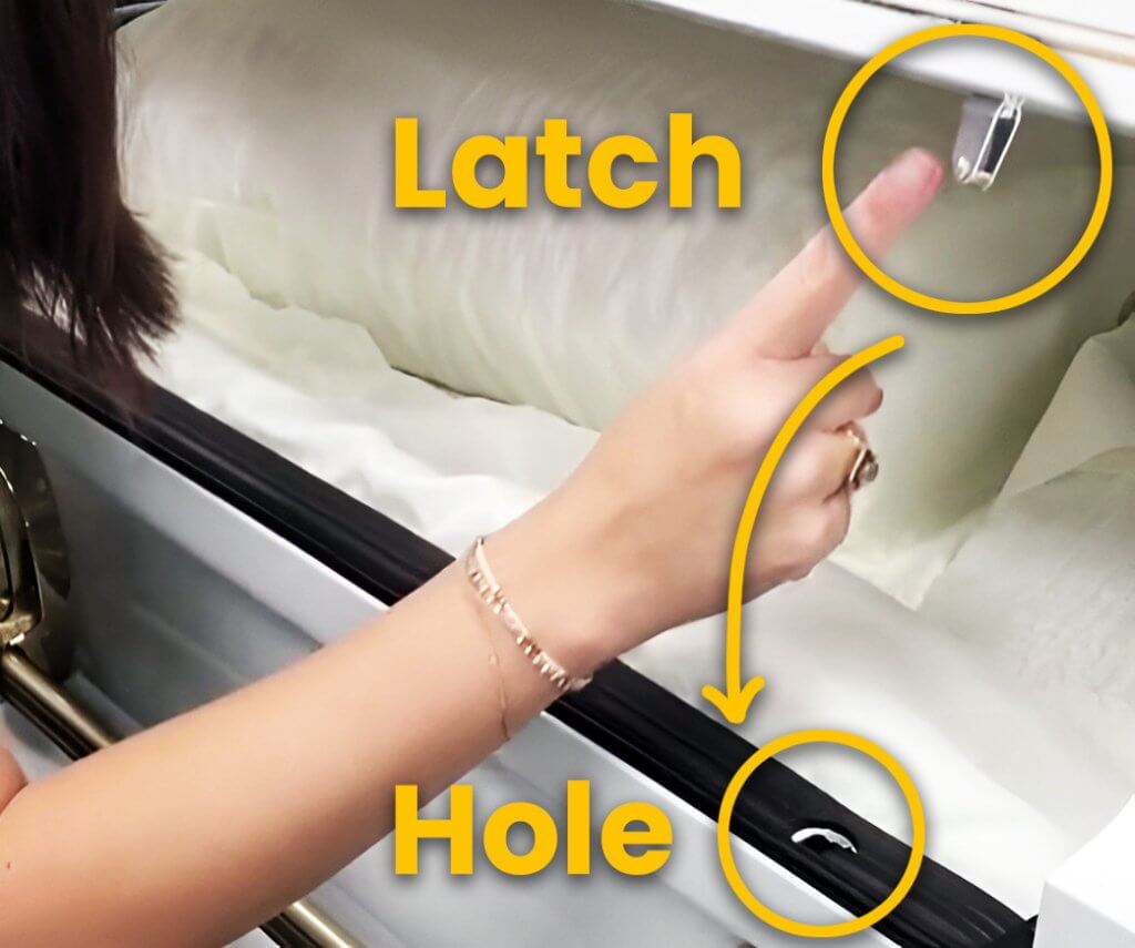 metal casket locking system showing latch and keyhole with labels